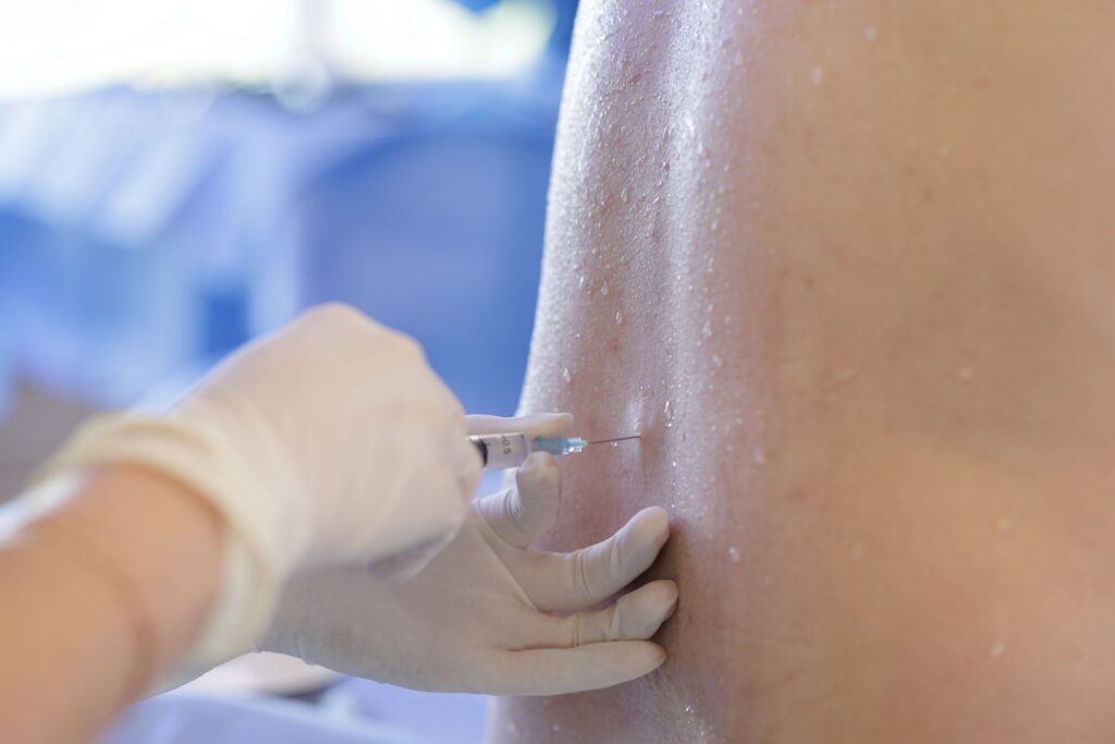 Injection being prepared for an image-guided pain management procedure