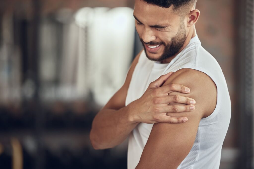 Young adult experiencing shoulder and upper arm pain